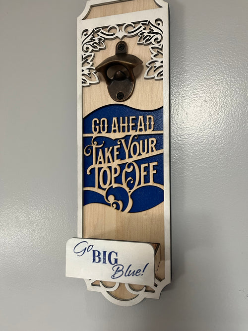 Sherrie’s Ky Creations bottle opener with a sleek metal design and ergonomic handle, suitable for opening beer and soda bottles.