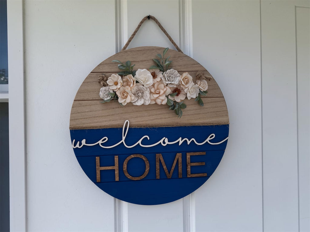Welcome door hanger by Sherrie’s Ky Creations with a decorative design hanging on a door.